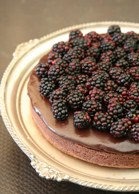 A dark as night choc cake with shiraz glaze and black berries